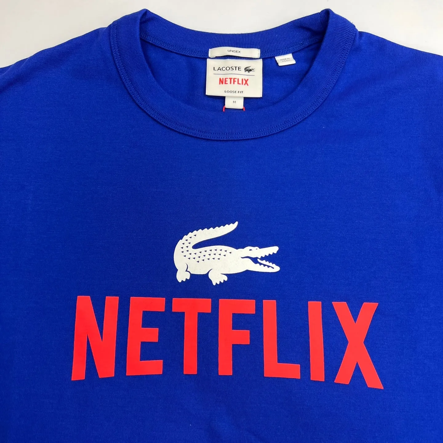 LACOSTE x NETFLIX Unisex Premium Loose-Fit Organic Cotton T-Shirt – Stylish and Eco-Friendly Design